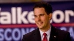 El gobernador de Wisconsin,Scott Walker firma la ley sobre las nuevas restricciones al aborto y Planned Parenthood promete juicio.